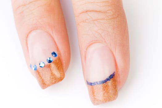 Beautiful female well-groomed colorful fingernails against white background