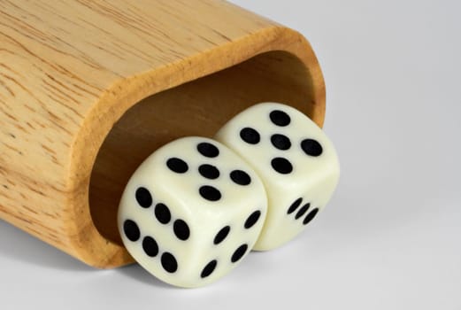 Shaker and dice showing 55