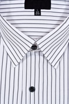 Folded white dress shirt filling the entire frame