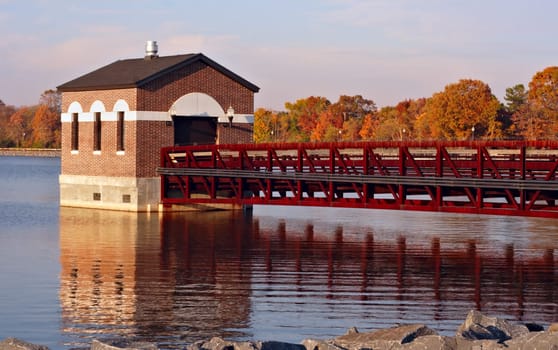 Reservoir in the fall with colorful leaves and reflections in the water