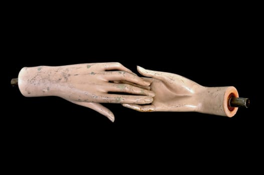 Weathered detached hands of plastic mannequin doll.