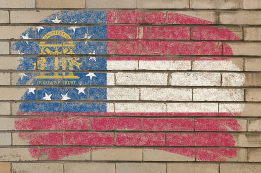 Chalky georgian flag painted with color chalk on grunge old brick wall
