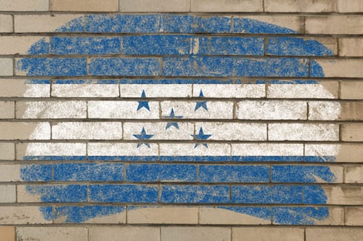 Chalky honduras flag painted with color chalk on grunge old brick wall