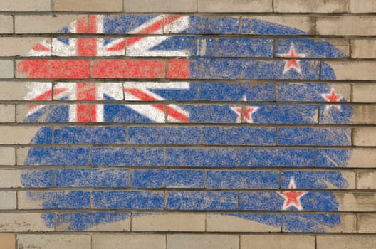 Chalky new zealand flag painted with color chalk on grunge old brick wall