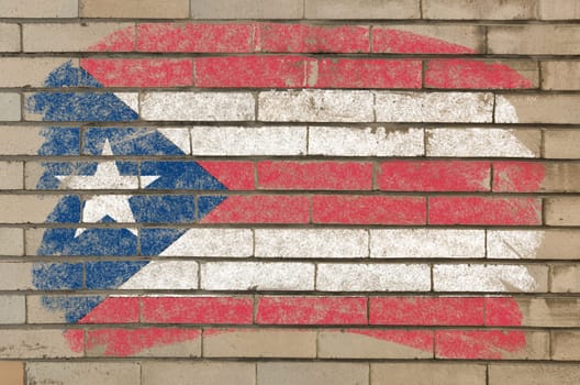 Chalky  flag painted with color chalk on grunge old brick wall