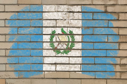 Chalky guatemalan flag painted with color chalk on grunge old brick wall