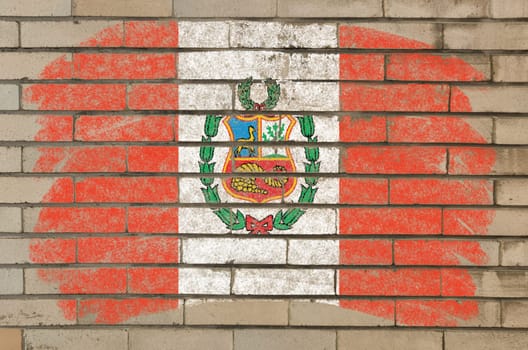 Chalky  flag painted with color chalk on grunge old brick wall
