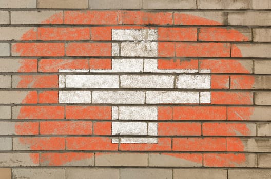 Chalky swiss flag painted with color chalk on grunge old brick wall