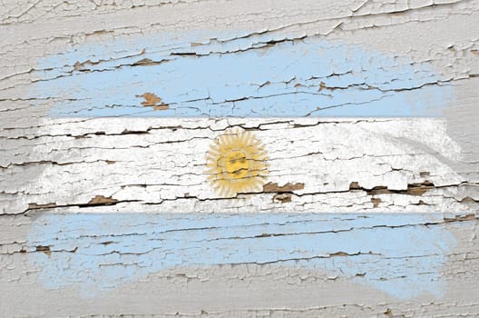 Chalky argentinian flag painted with color chalk on grunge wooden texture