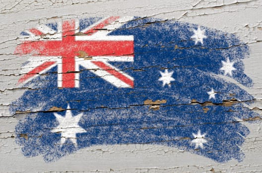 Chalky australian flag painted with color chalk on grunge wooden texture