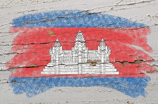 Chalky cambodian flag painted with color chalk on grunge wooden texture