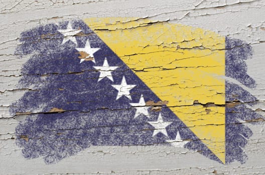 Chalky bosnia and herzegovina flag painted with color chalk on grunge wooden texture
