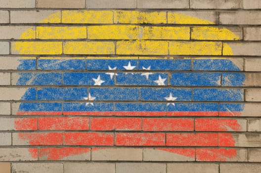 Chalky  flag painted with color chalk on grunge old brick wall