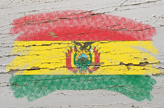 Chalky bolivian flag painted with color chalk on grunge wooden texture