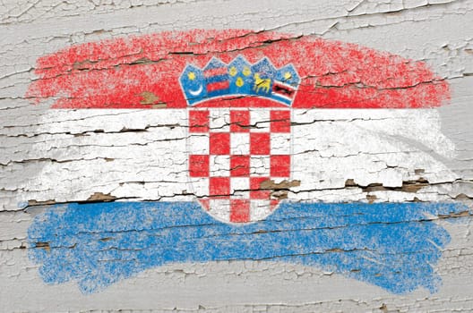 Chalky  croatian flag painted with color chalk on grunge wooden texture