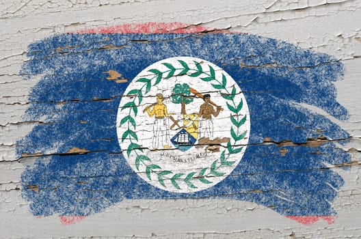 Chalky belize flag painted with color chalk on grunge wooden texture