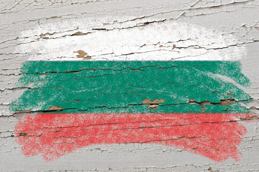 Chalky bulgarian flag painted with color chalk on grunge wooden texture