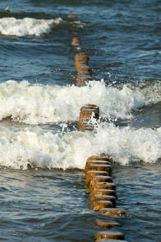 Breakwater made of logs in the Baltic Sea