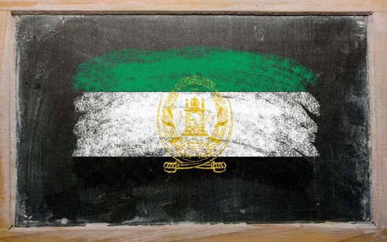 Chalky afghanistan flag painted with color chalk on old blackboard