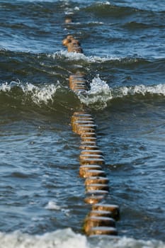 Breakwater made of logs in the Baltic Sea