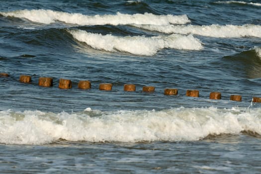 Breakwater made of logs in the Baltic Sea