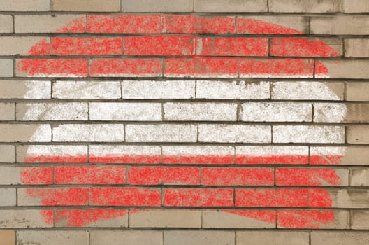 Chalky austrian flag painted with color chalk on grunge old brick wall