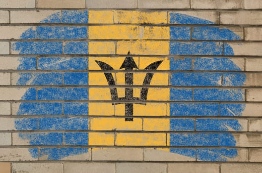 Chalky barbados flag painted with color chalk on grunge old brick wall