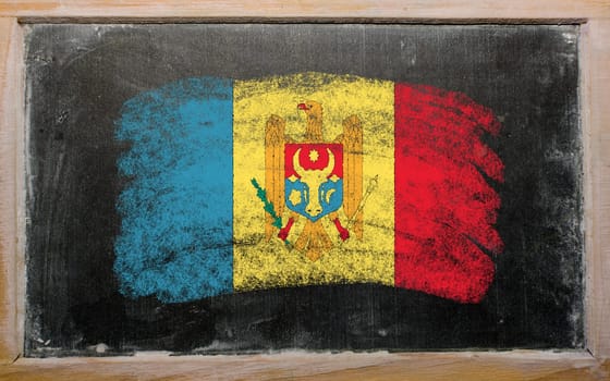 Chalky moldova flag painted with color chalk on old blackboard