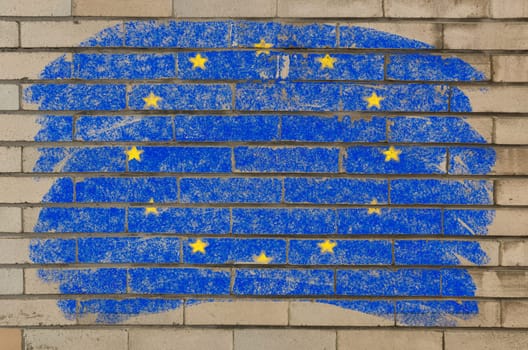 Chalky european union flag painted with color chalk on grunge old brick wall