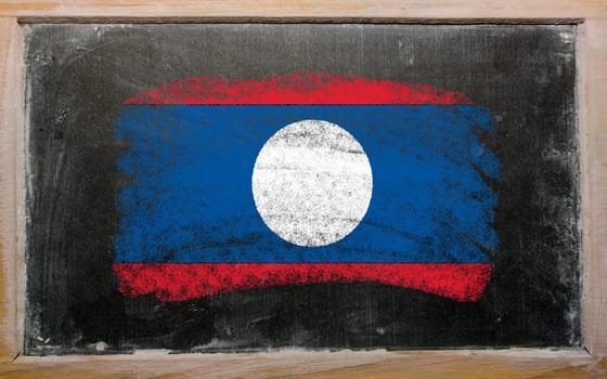 Chalky laos flag painted with color chalk on old blackboard