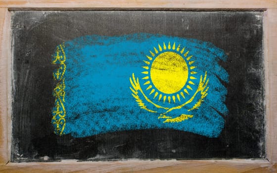 Chalky kazakstan flag painted with color chalk on old blackboard