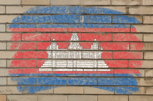 Chalky cambodian flag painted with color chalk on grunge old brick wall