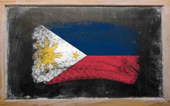 Chalky phillip flag painted with color chalk on old blackboard