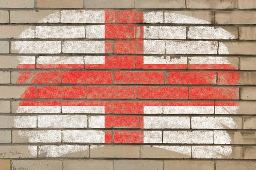 Chalky english flag painted with color chalk on grunge old brick wall