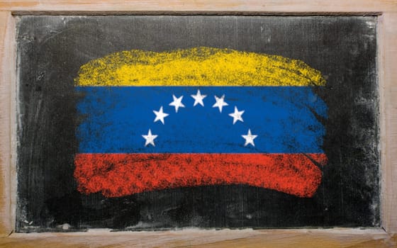 Chalky venezuelan flag painted with color chalk on old blackboard