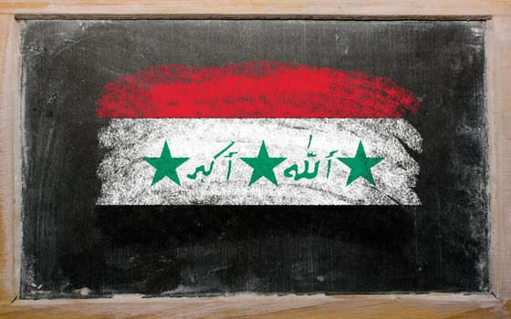 Chalky iraq flag painted with color chalk on old blackboard