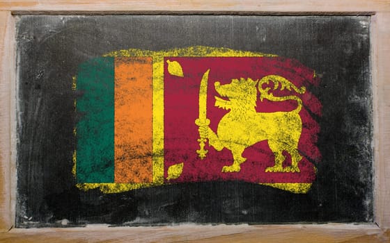Chalky srilankan flag painted with color chalk on old blackboard