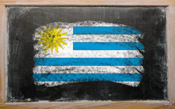 Chalky uruguay flag painted with color chalk on old blackboard