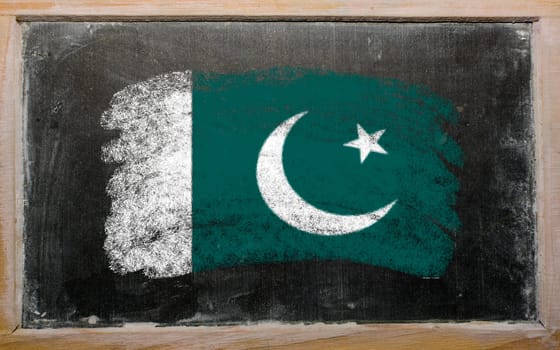 Chalky Pakistan flag painted with color chalk on old blackboard