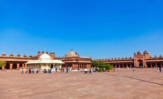 FATEPHUR SIKRI, INDIA - NOVEMBER 17: Pilgrims visit the Jama Masjid Mosque on November 17,2011 in Fatehpur Sikri, India. The mosque was constructed by Mughal emperor Akbar beginning in 1570.