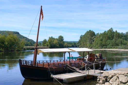 A walk in boat on the Dordogne on board traditional boatscalled barges or gabarres