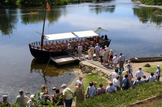 A walk in boat on the Dordogne on board traditional boatscalled barges or gabarres
