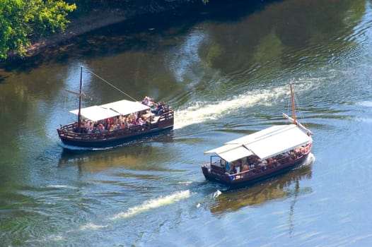 A walk in boat on the Dordogne on board traditional boatscalled barges or gabarres