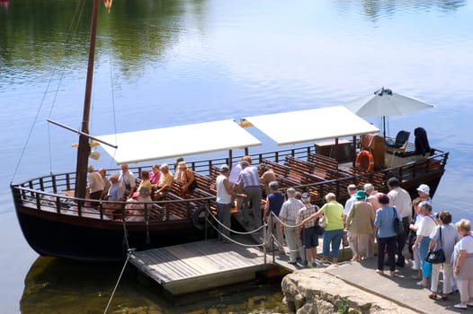 A walk in boat on the Dordogne on board traditional boats called barges or gabarres