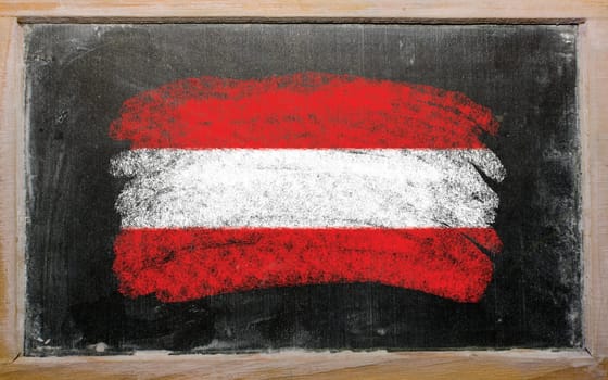 Chalky austrian flag painted with color chalk on old blackboard