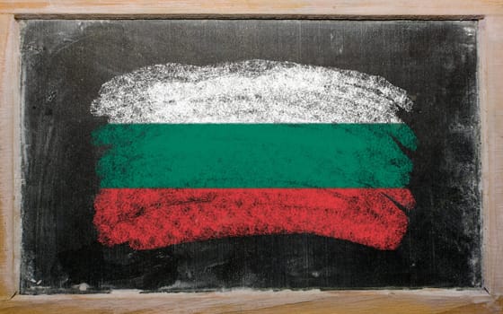 Chalky bulgarian flag painted with color chalk on old blackboard