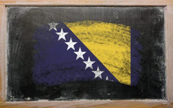 Chalky bosnia and herzegovina flag painted with color chalk on old blackboard