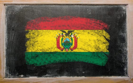 Chalky bolivian flag painted with color chalk on old blackboard