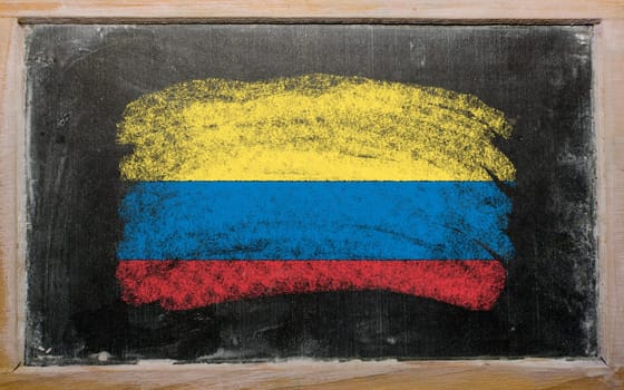 Chalky columbian flag painted with color chalk on old blackboard