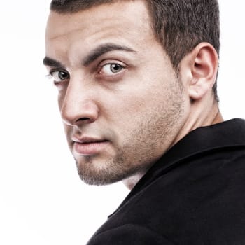 Handsome man portrait looking back on white background